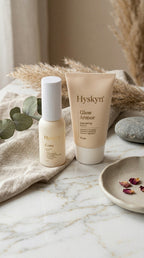 Hyskyn skincare products on a marble surface with natural elements.
