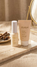Two Hyskyn skincare products on a marble surface with a neutral background