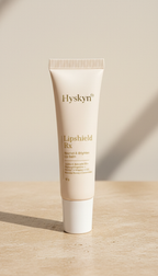 Hysken lip balm for dark lips tube on a wooden surface with a beige background
